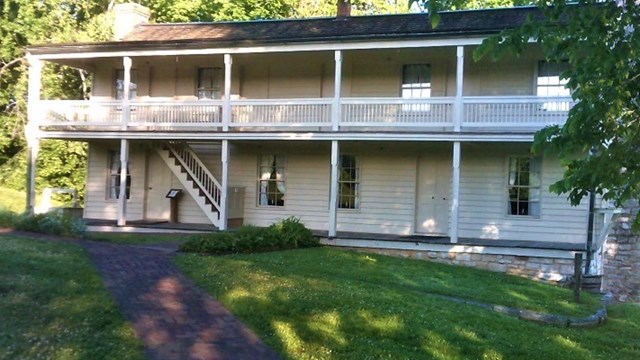 two story historic site and tree